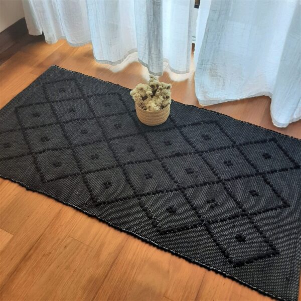 small black rug knotted