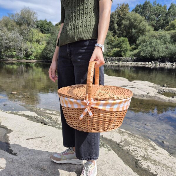 round picnic basket with checked lining